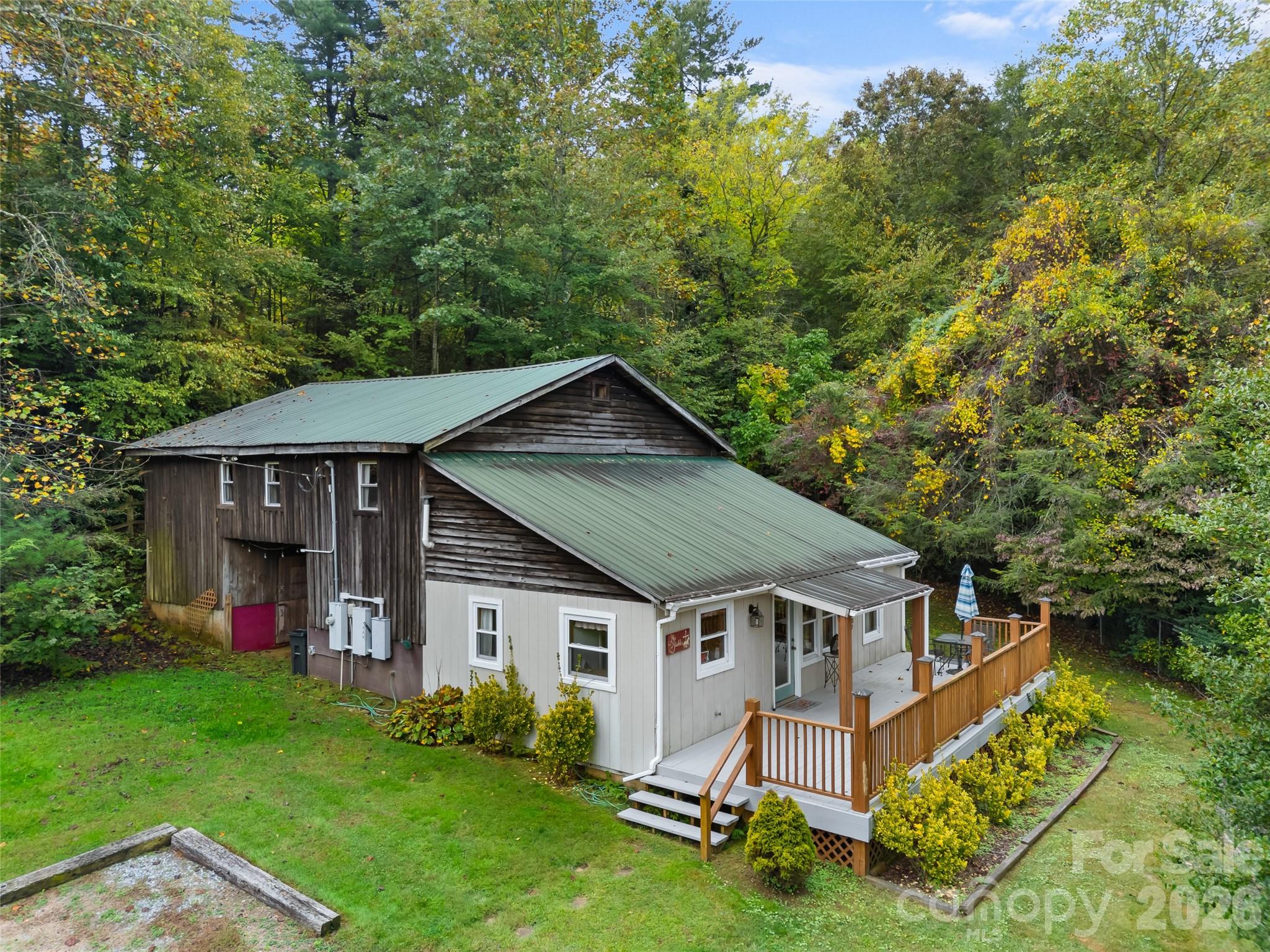 645 West Fork Creek Road Saluda, NC 28773 - Photo 38 of 44 a front view of a house with garden