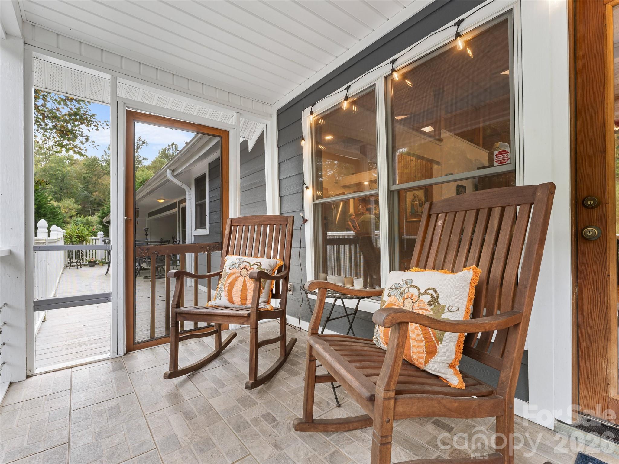 645 West Fork Creek Road Saluda, NC 28773 - Photo 4 of 44 a view of a porch with chairs and backyard