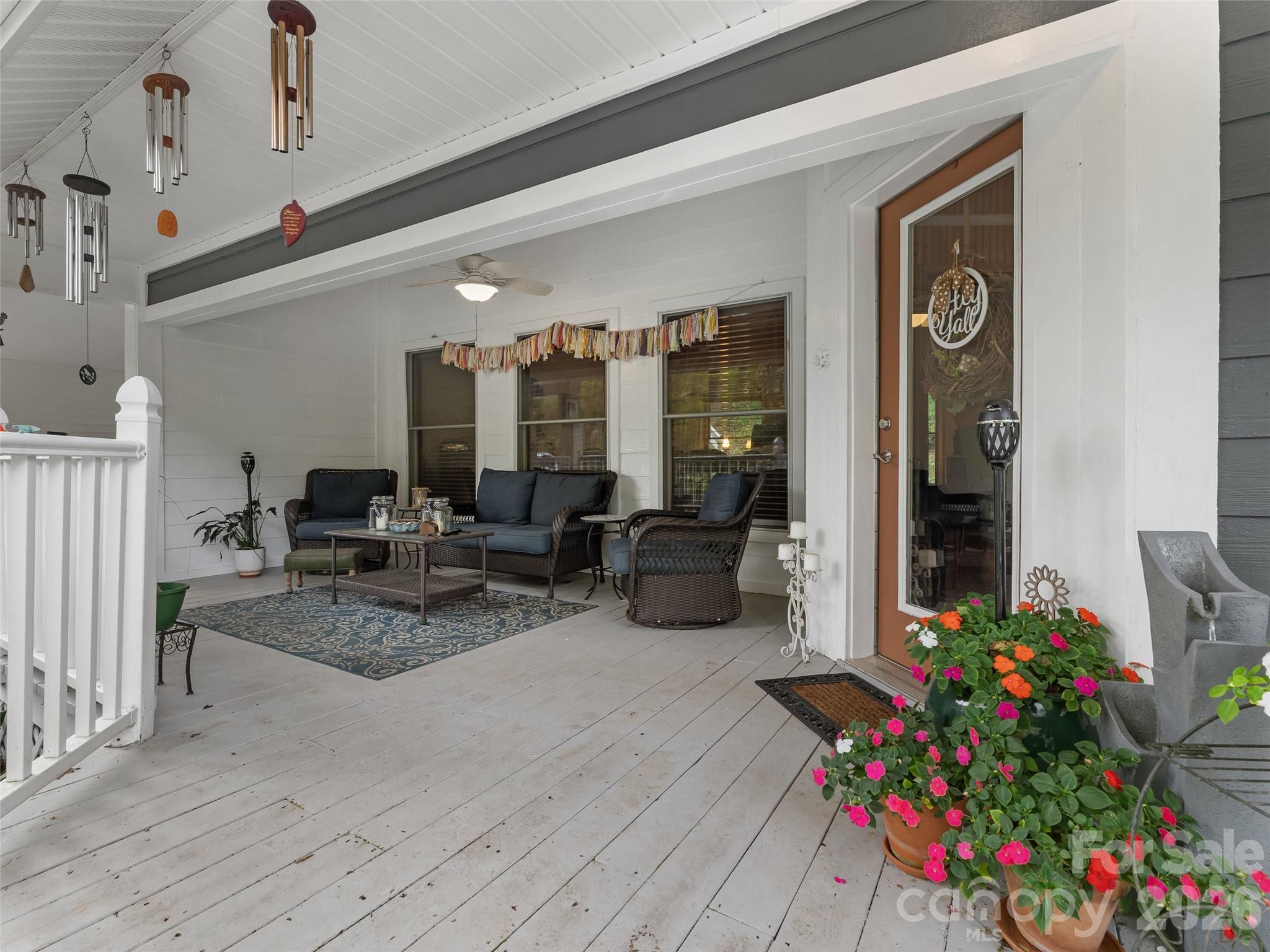 645 West Fork Creek Road Saluda, NC 28773 - Photo 5 of 44 a lobby with furniture and flowers