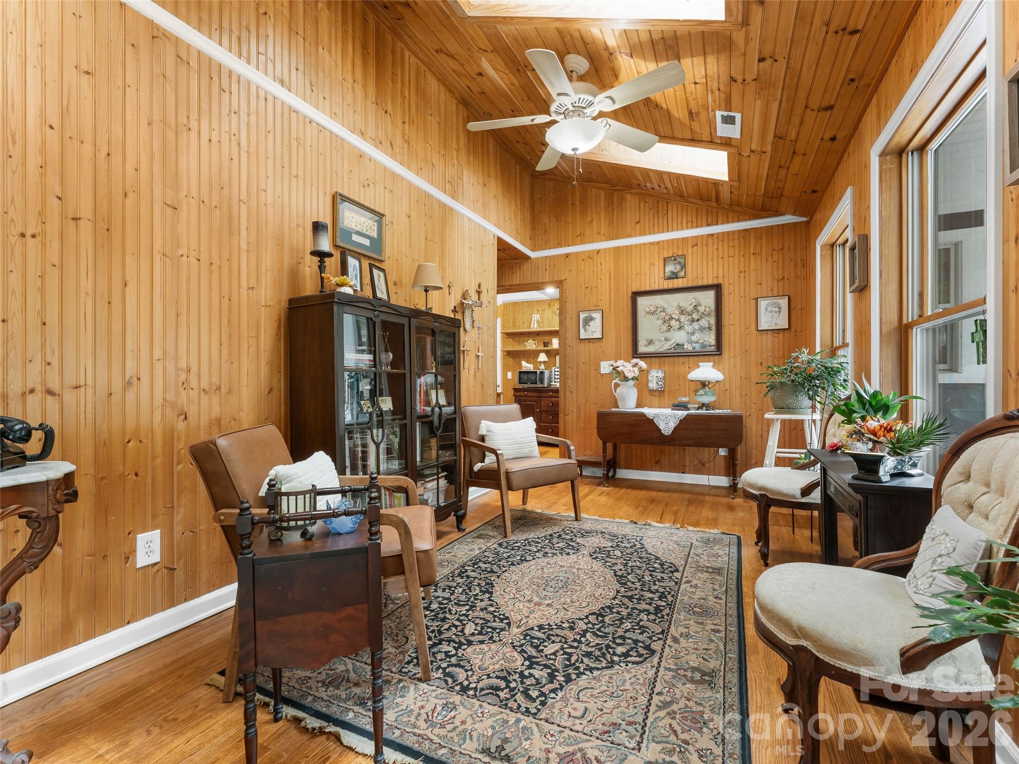 645 West Fork Creek Road Saluda, NC 28773 - Photo 6 of 44 a living room with patio furniture and a chandelier