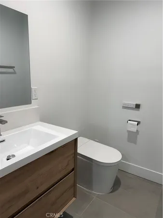 a bathroom with a sink a toilet and a bathtub