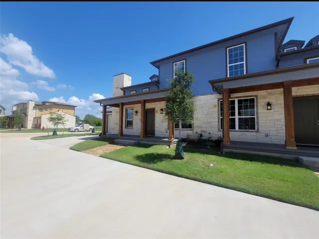 a view of house with outdoor space and porch