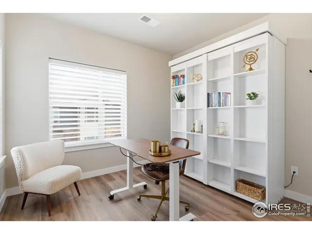 a workspace with furniture and a window