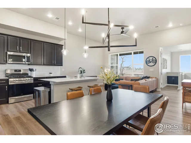 a kitchen with stainless steel appliances granite countertop a sink a stove and center island