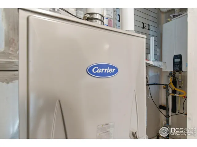 a view of storage and utility room with a window