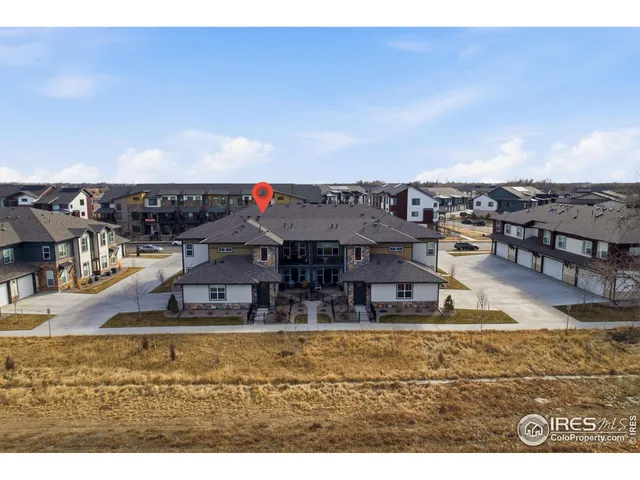 an aerial view of residential building and ocean