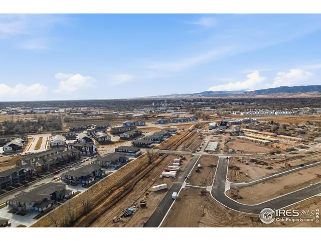 a aerial view of residential houses with outdoor space