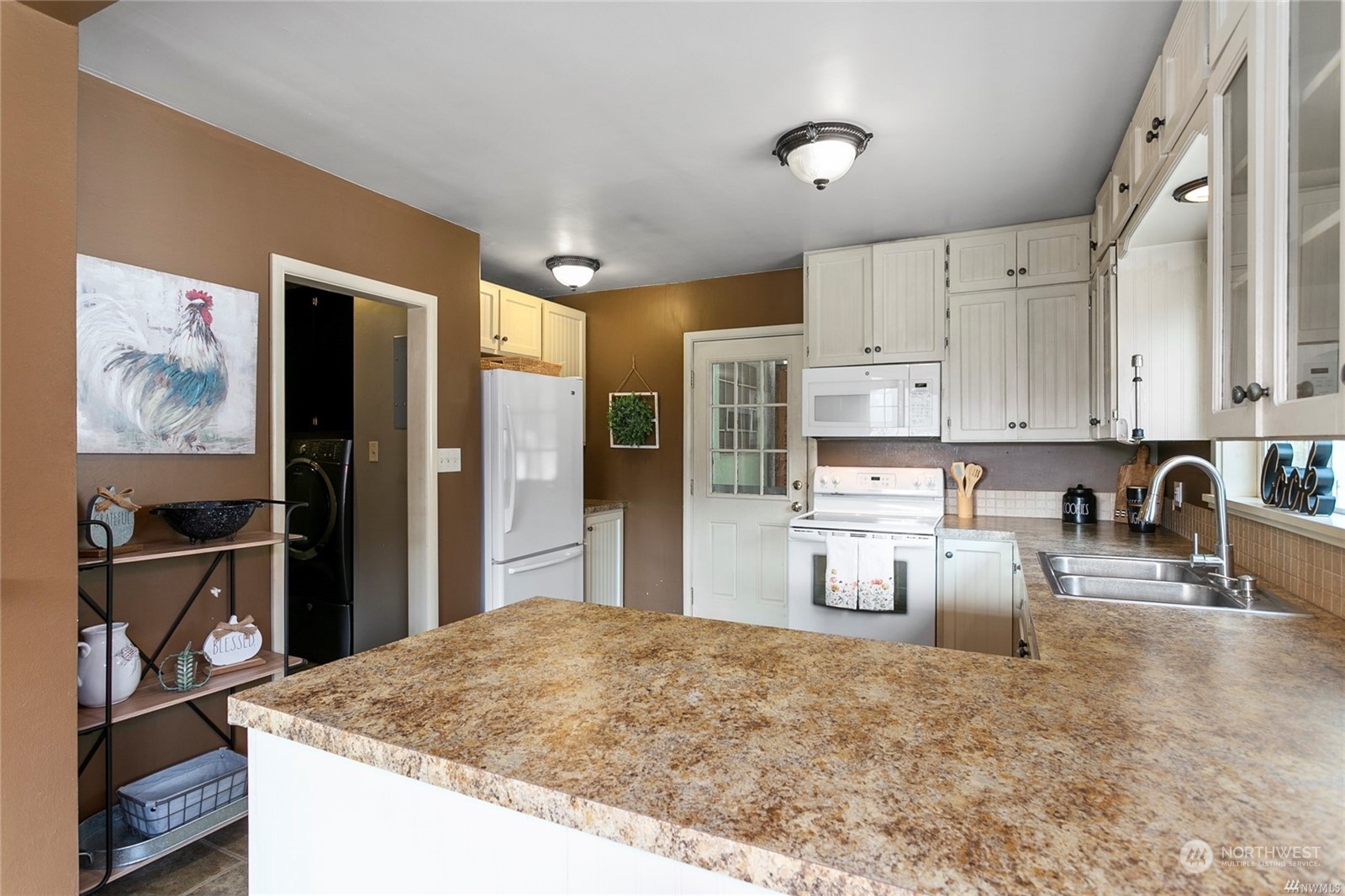 3354 Berg Road Everson, WA 98247 - Photo 11 of 35 a kitchen with stainless steel appliances granite countertop a refrigerator sink and stove