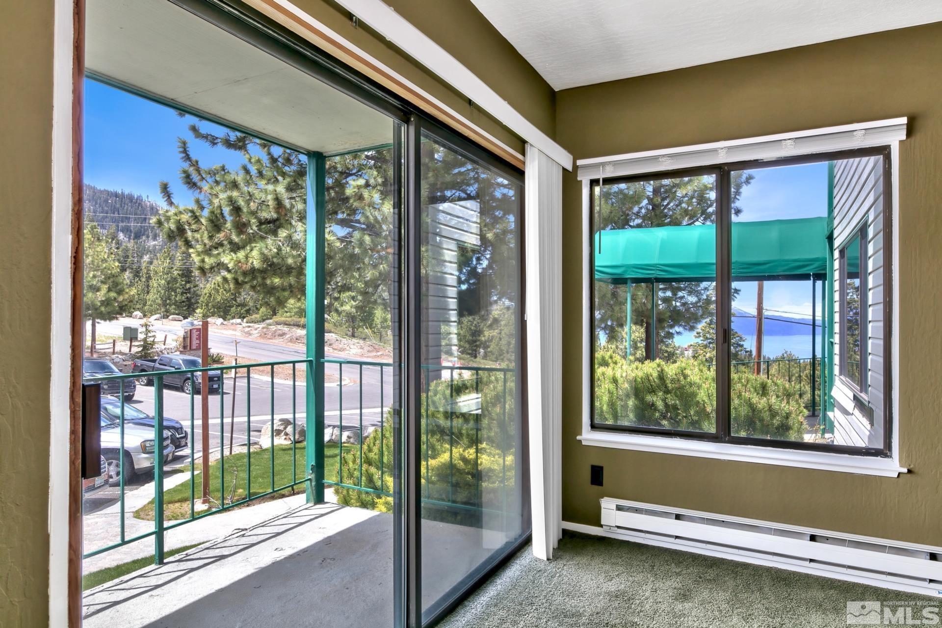 313 Tramway Drive, Unit 9 Stateline, NV 89449 - Photo 3 of 21 a view of a porch with a floor to ceiling window
