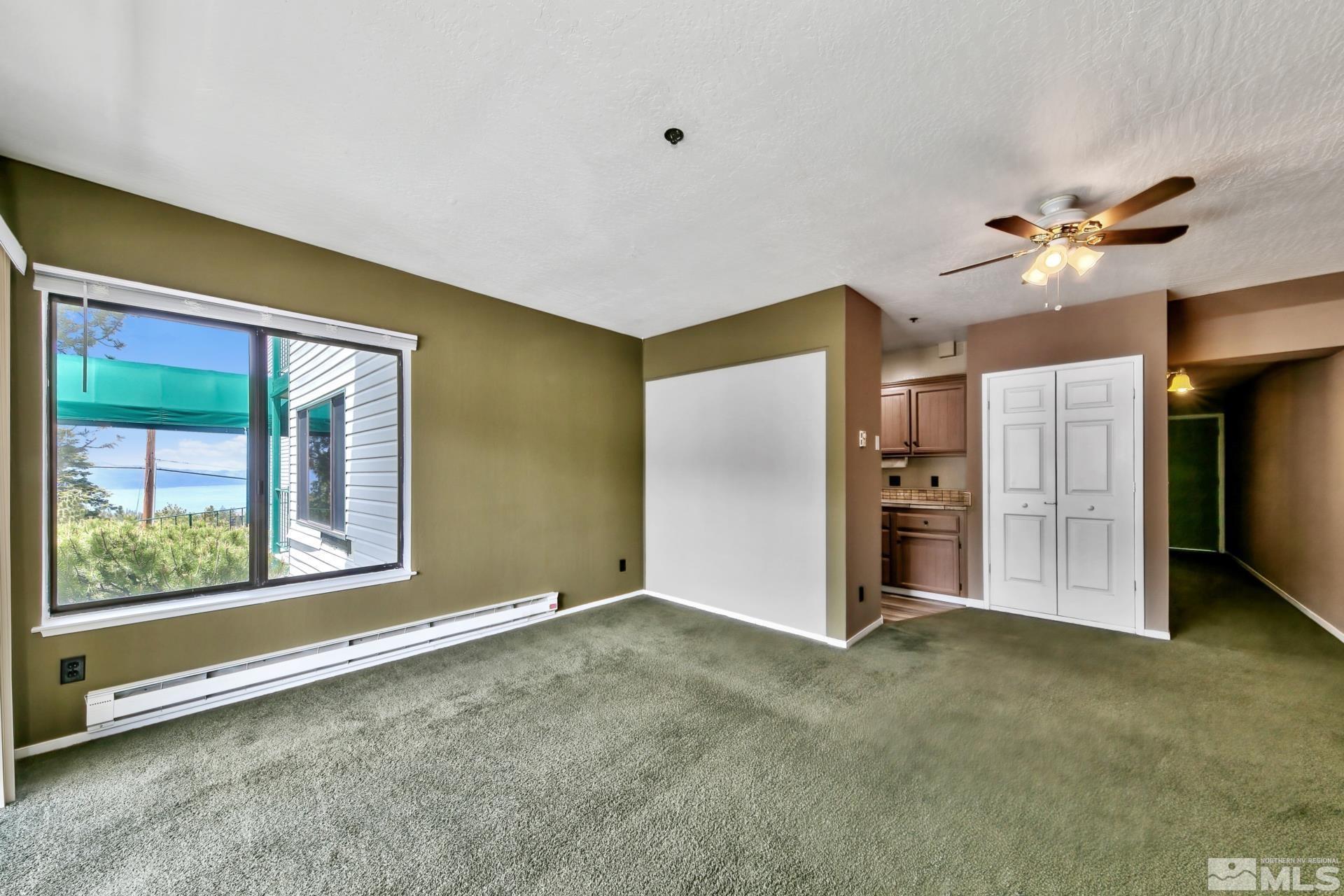 313 Tramway Drive, Unit 9 Stateline, NV 89449 - Photo 8 of 21 a view of an empty room with a window