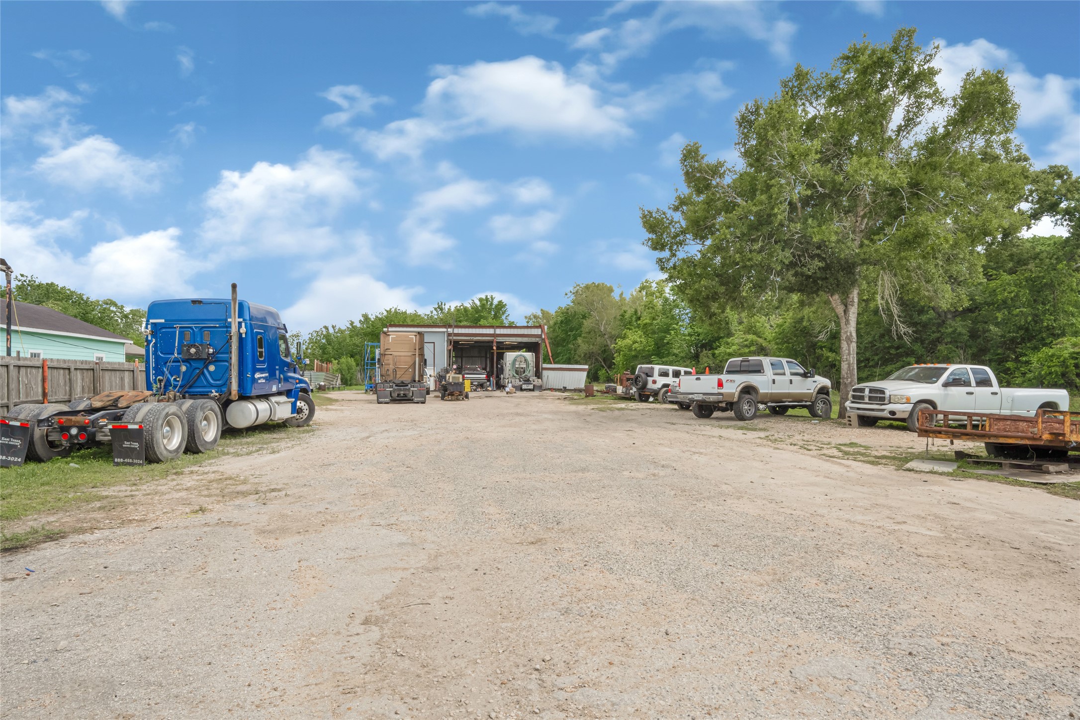 811 Coen Road Rosharon, TX 77583 - Photo 13 of 23 a view of road with card parked on bed and parked cars