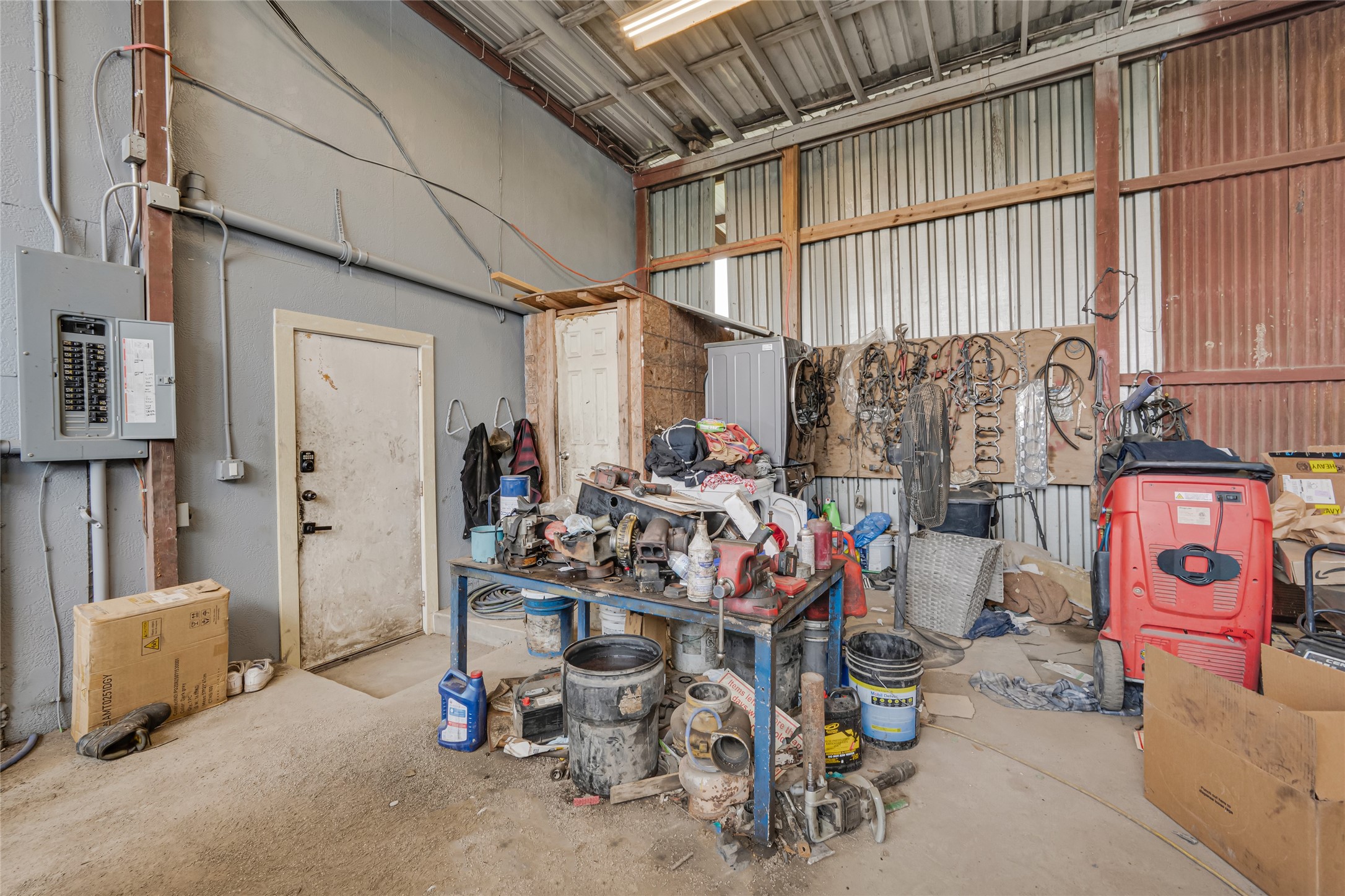811 Coen Road Rosharon, TX 77583 - Photo 18 of 23 a view of a storage room with a lot of stuff