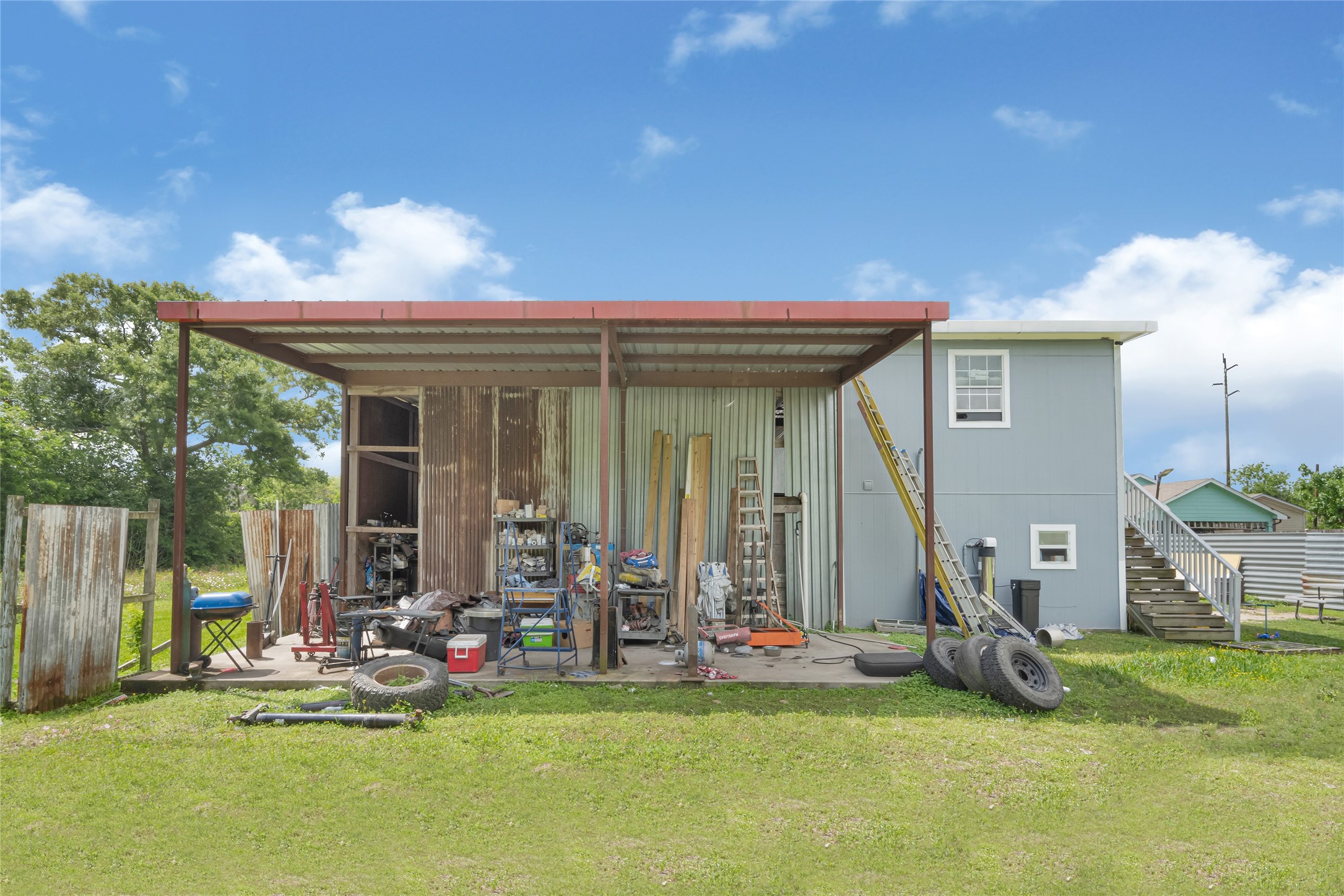 811 Coen Road Rosharon, TX 77583 - Photo 19 of 23 a view of a house with backyard porch and sitting area