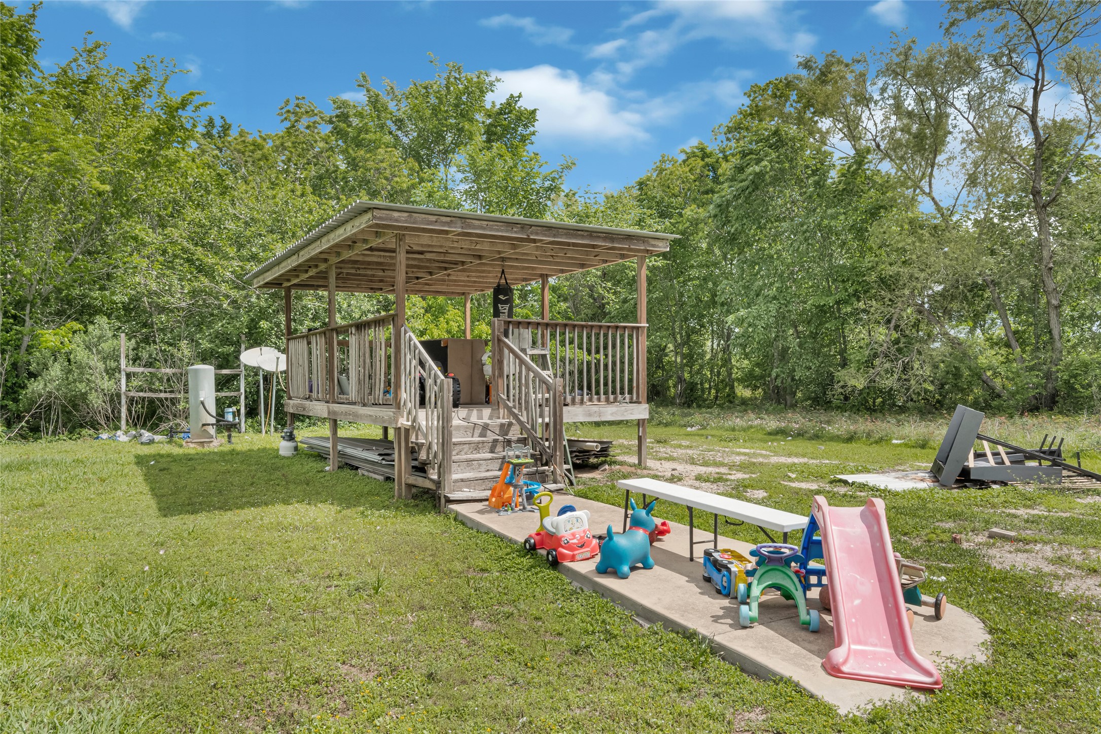 811 Coen Road Rosharon, TX 77583 - Photo 22 of 23 a view of a wooden deck with a yard