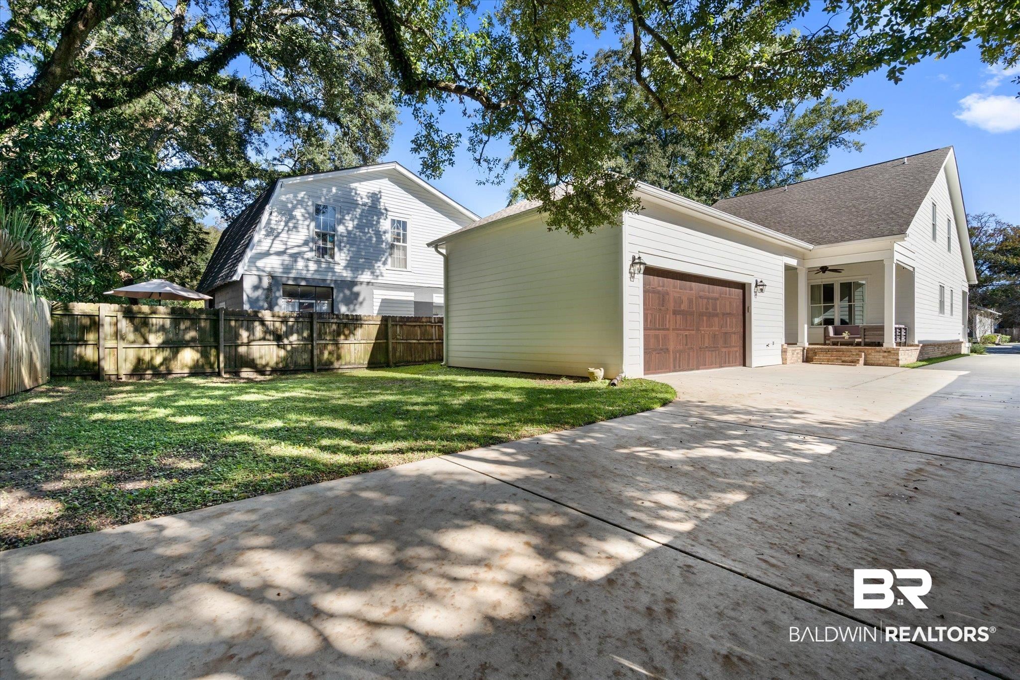 15 Semmes Avenue Mobile, AL 36604 - Photo 7 of 43 Exterior space with ceiling fan, a yard, and a garage