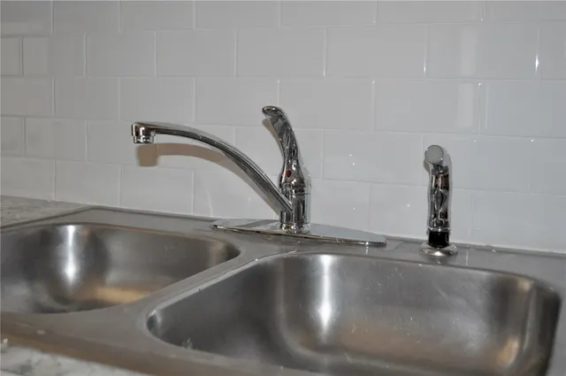 a view of a sink in a kitchen