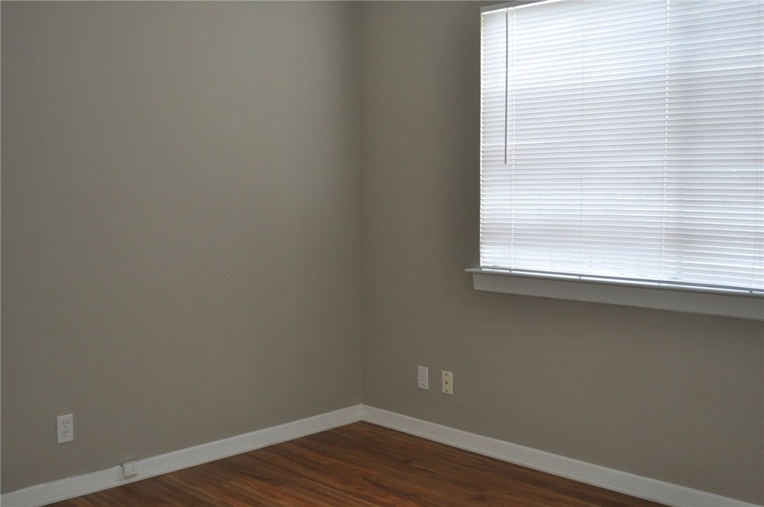 5916 B Cherry Loop Austin, TX 78745 - Photo 6 of 10 a view of a small space with wooden floor and a window
