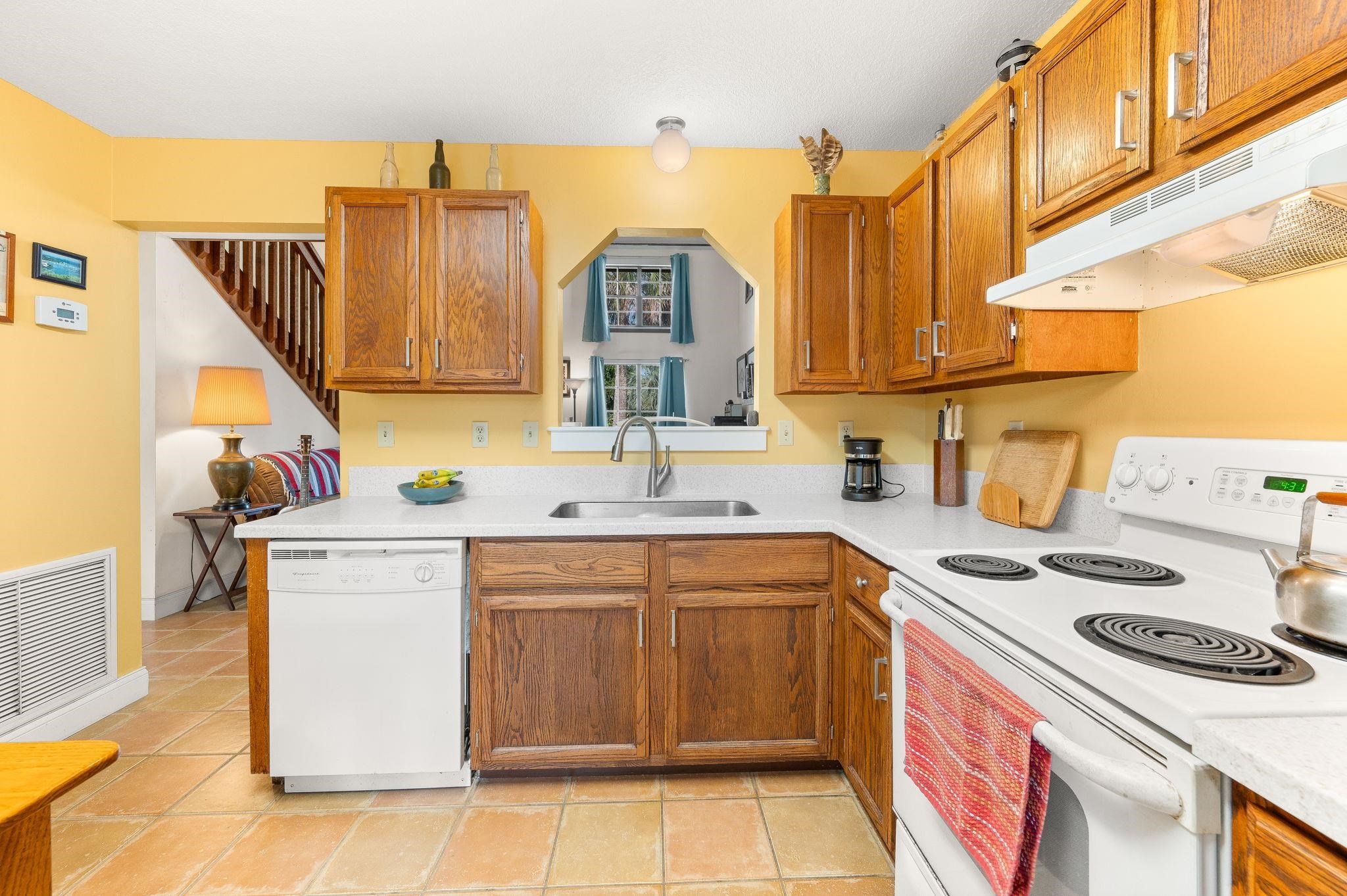 1126 Prince Road St. Augustine, FL 32086 - Photo 11 of 42 a kitchen with a sink stove and cabinets