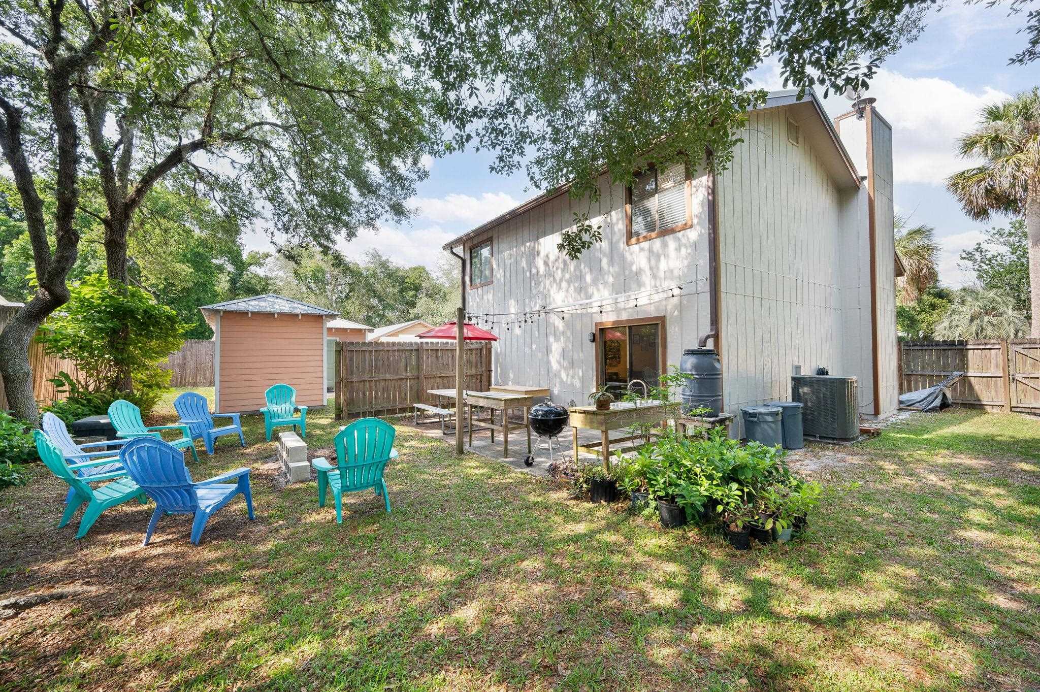 1126 Prince Road St. Augustine, FL 32086 - Photo 26 of 42 a view of backyard with seating and green space