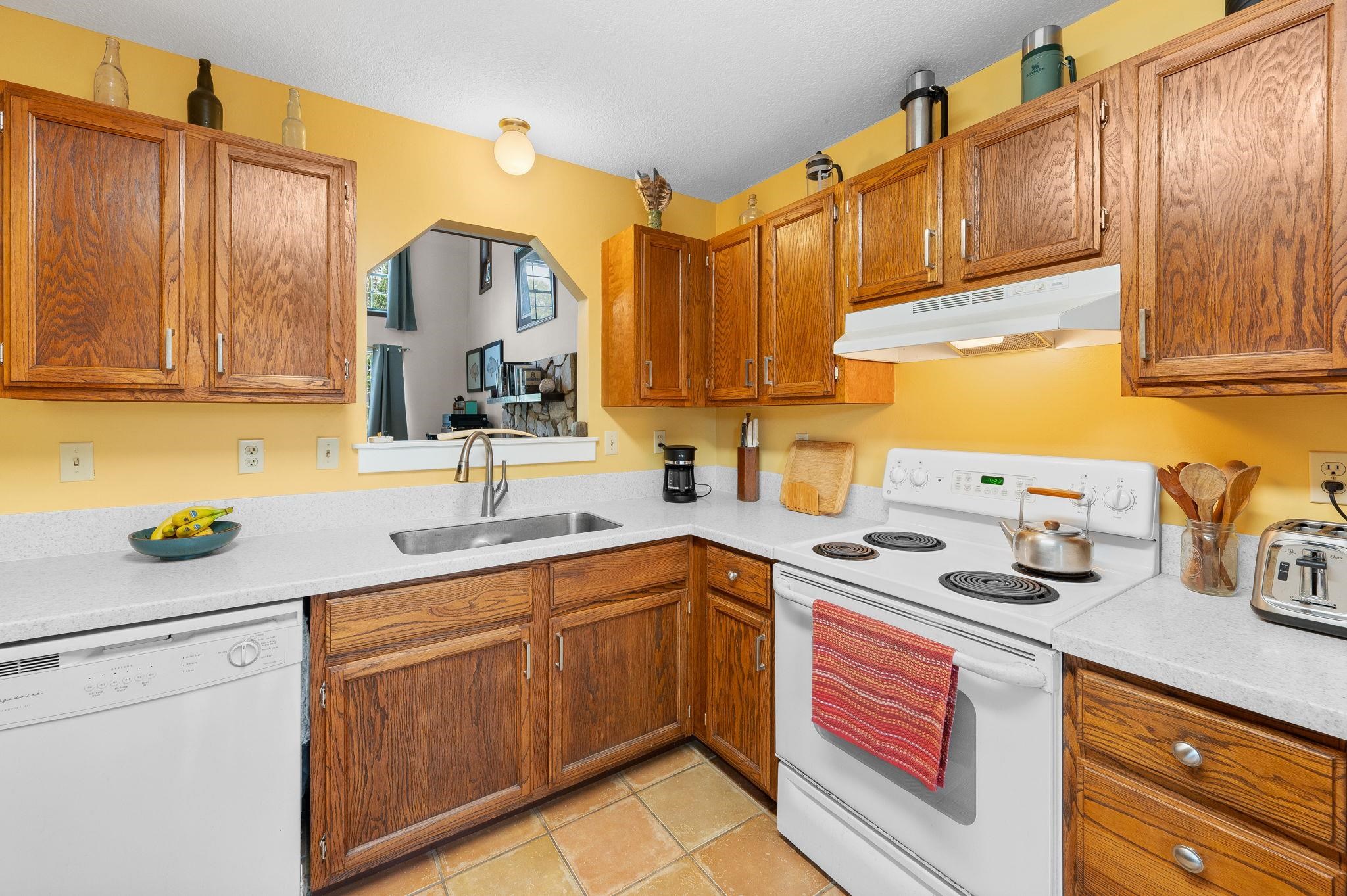 1126 Prince Road St. Augustine, FL 32086 - Photo 10 of 42 a kitchen with a sink stove and cabinets