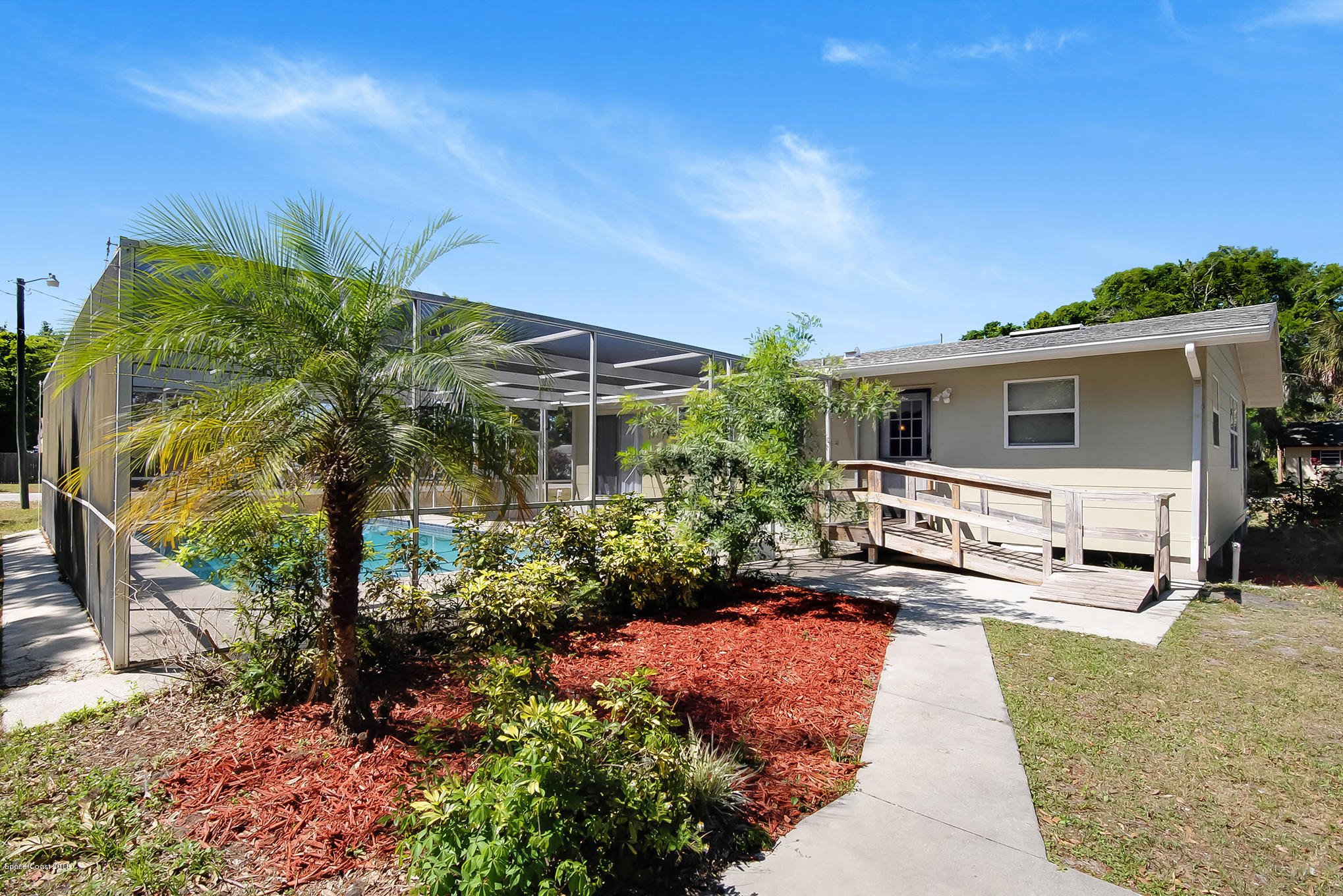 1053 Bernice Road Rockledge, FL 32955 - Photo 11 of 30 a front view of a house with a yard