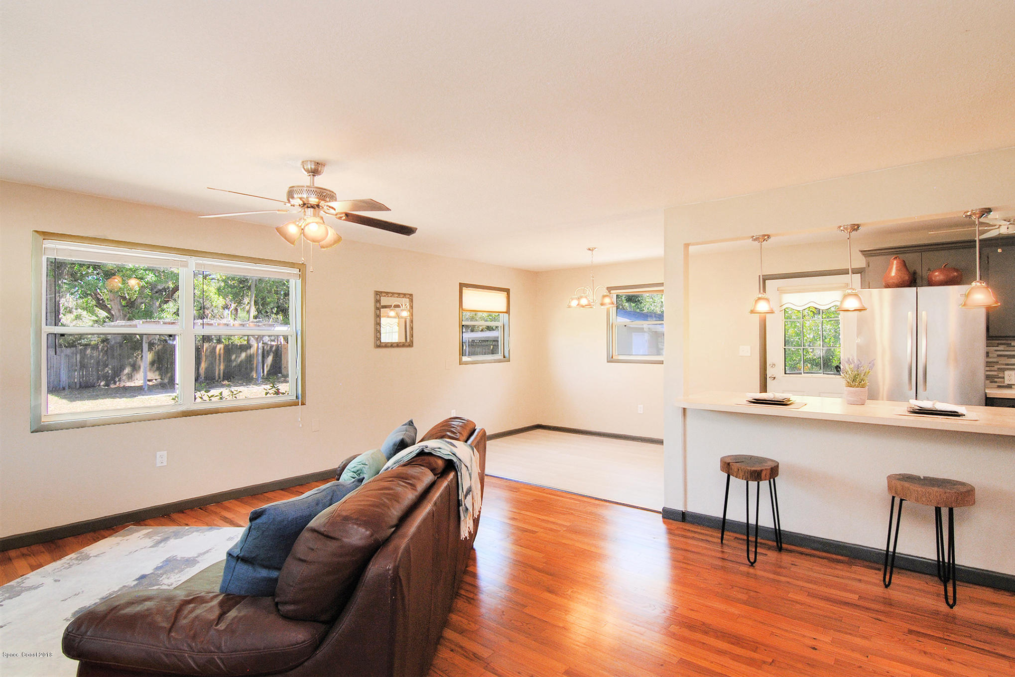 1053 Bernice Road Rockledge, FL 32955 - Photo 14 of 30 a living room with furniture and a large window