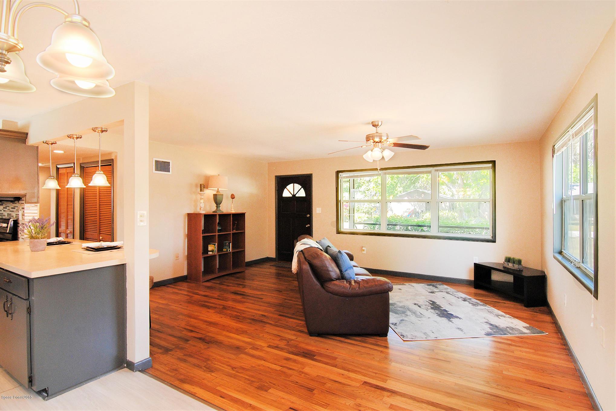 1053 Bernice Road Rockledge, FL 32955 - Photo 15 of 30 a living room with furniture and large windows