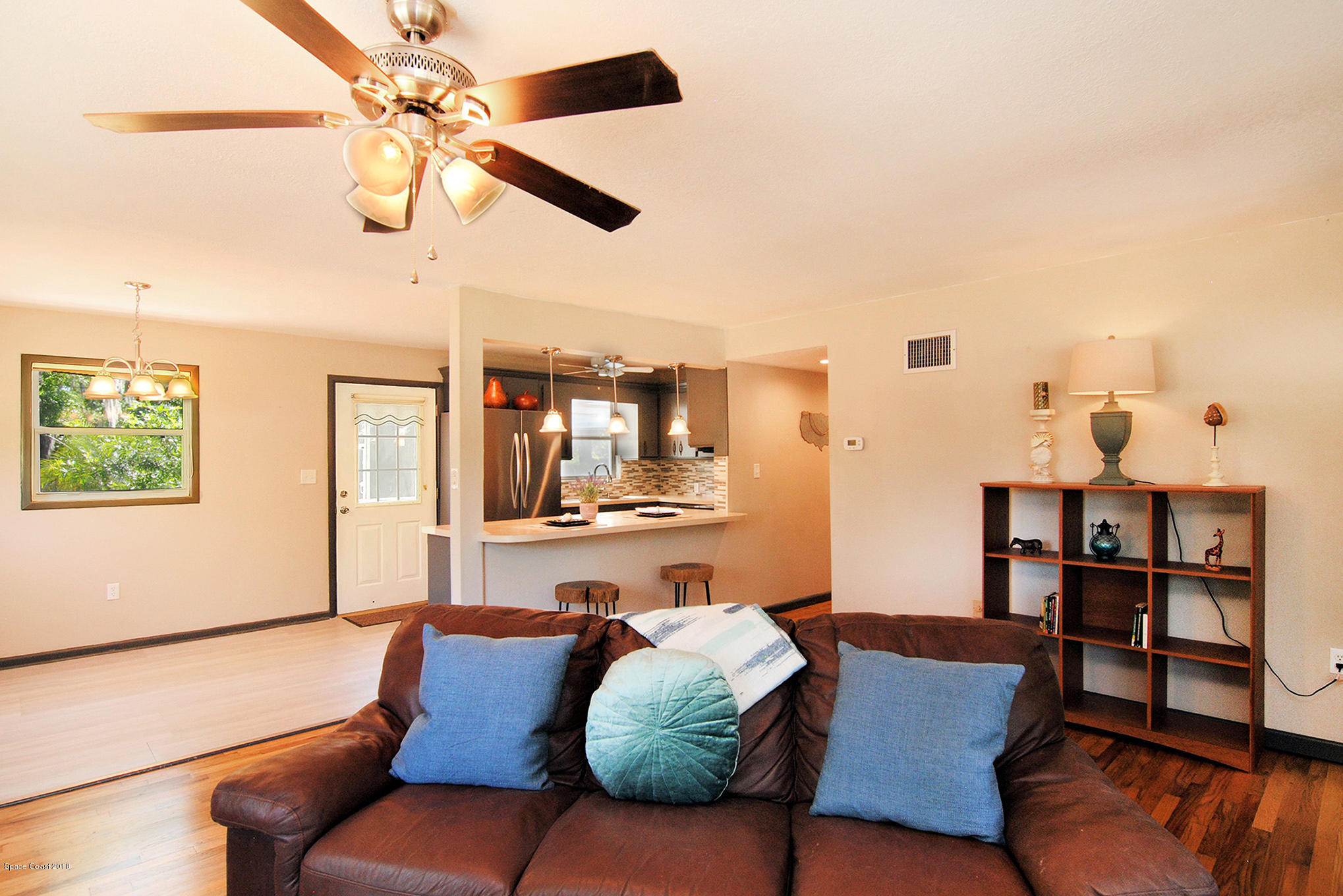 1053 Bernice Road Rockledge, FL 32955 - Photo 16 of 30 a living room with furniture and a wooden floor