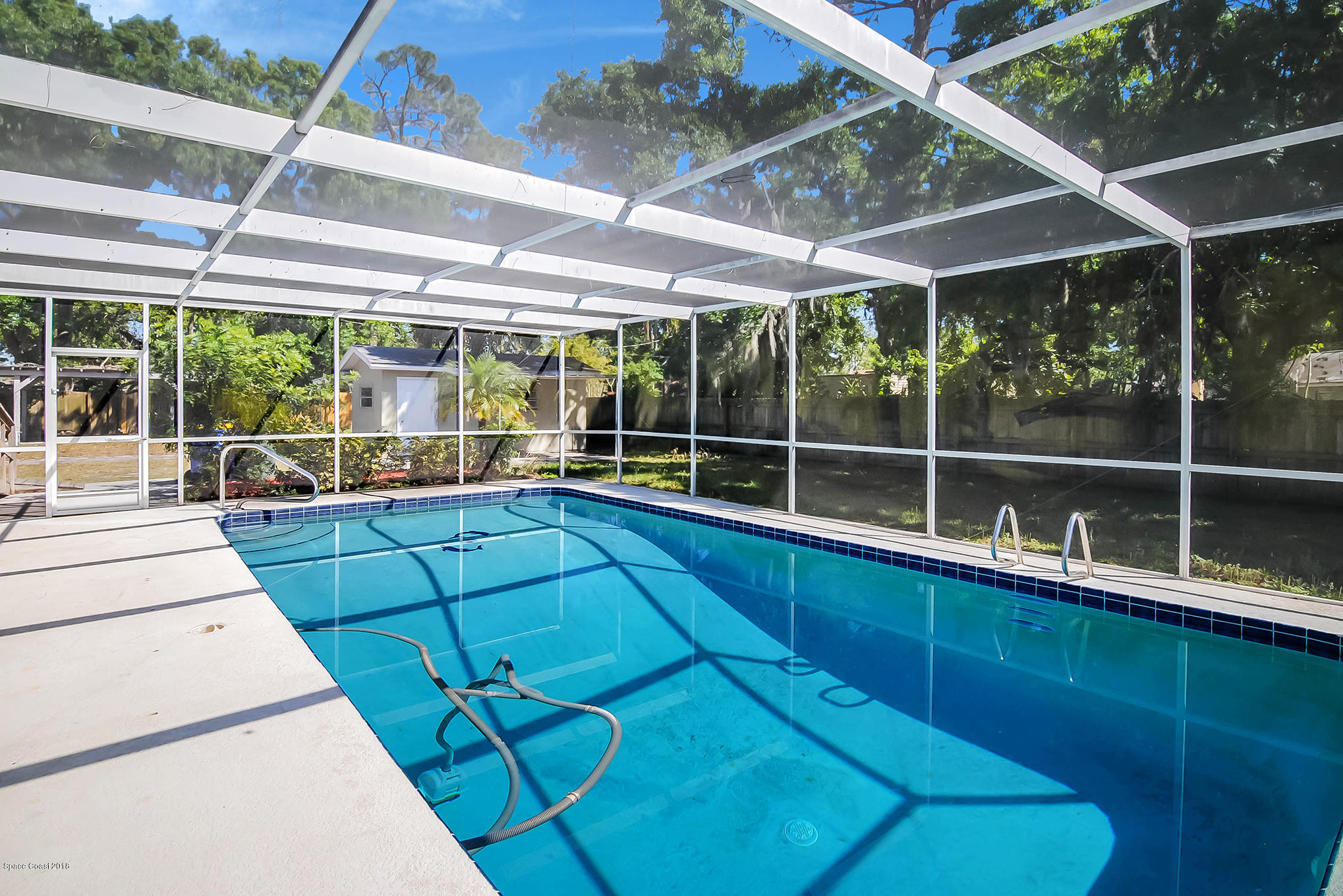 1053 Bernice Road Rockledge, FL 32955 - Photo 3 of 30 a room with pool table and windows