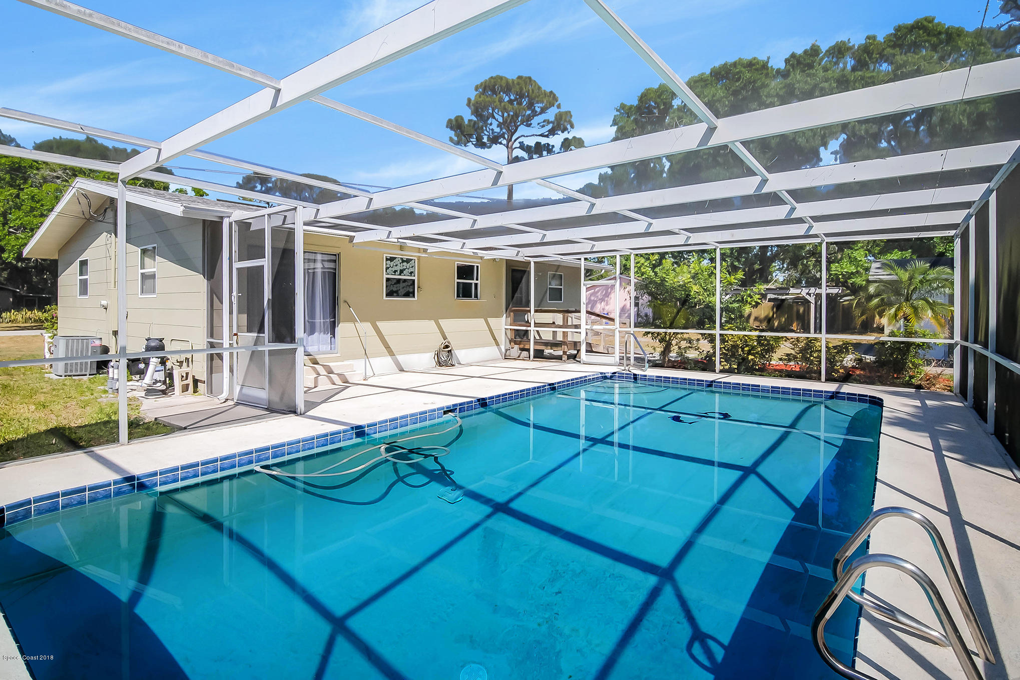 1053 Bernice Road Rockledge, FL 32955 - Photo 29 of 30 a view of a patio with swimming pool