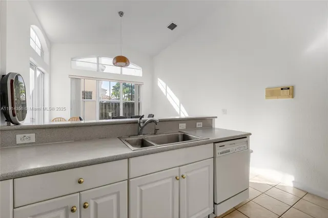 a kitchen with a sink and a window