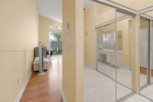 a bathroom with a shower sink and mirror