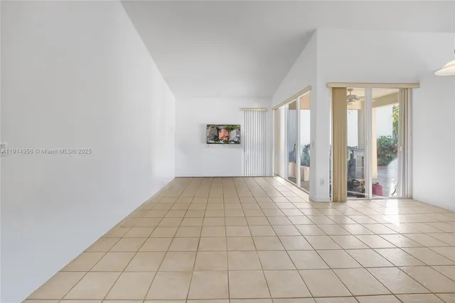 a view of an empty room and window