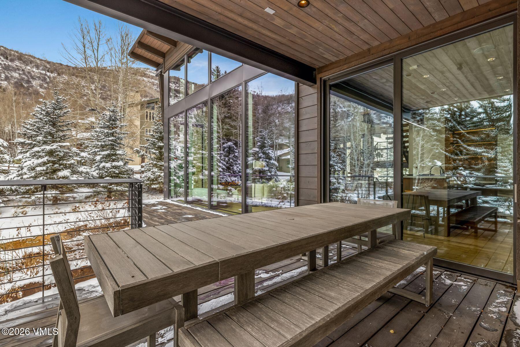 2440 Chamonix Lane Vail, CO 81657 - Photo 14 of 36 a outdoor sitting area with view of the house