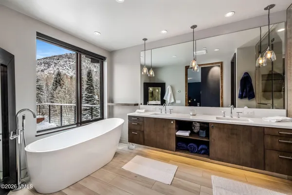 a large spacious bathroom with a large tub and sink