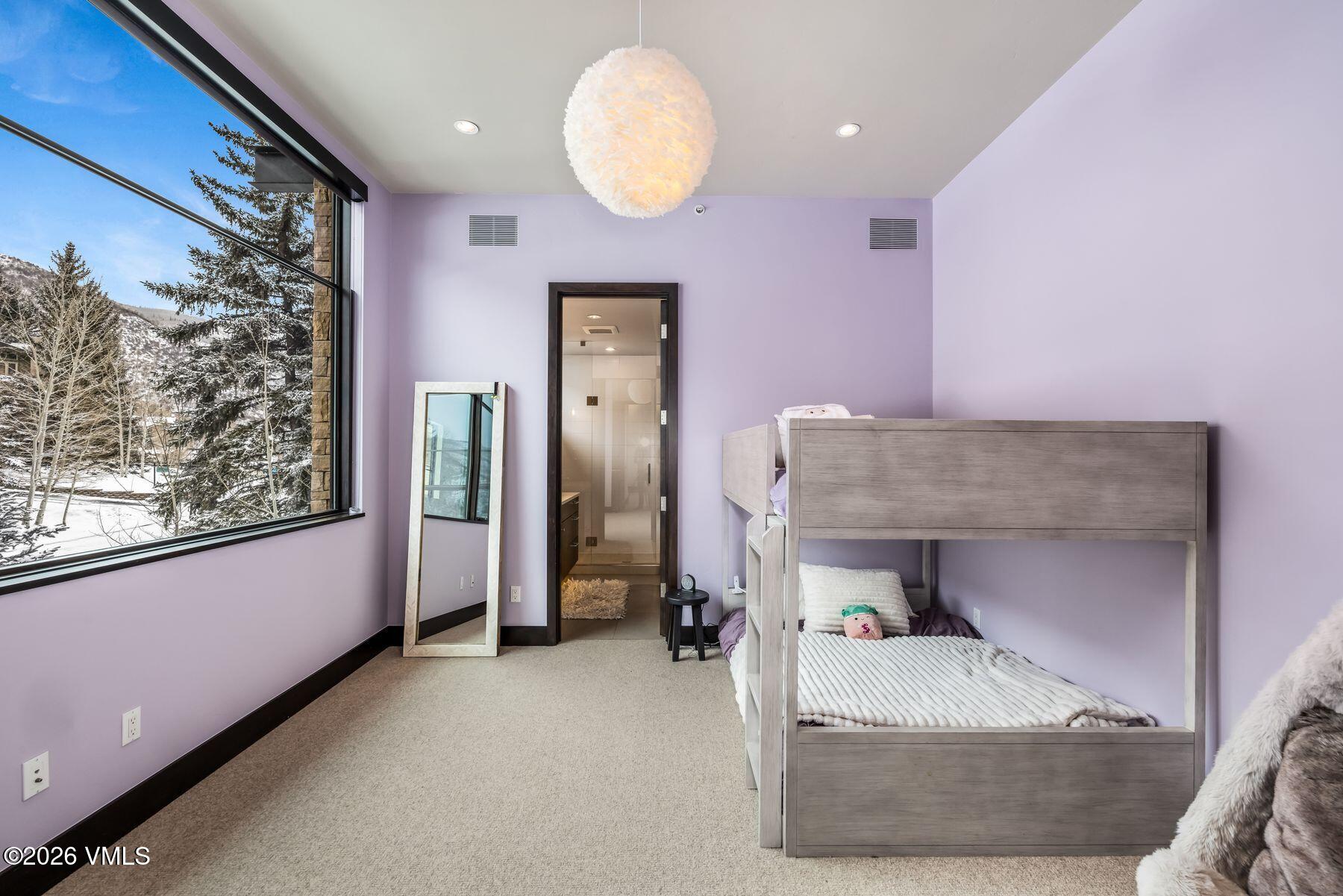 2440 Chamonix Lane Vail, CO 81657 - Photo 25 of 36 a living room with furniture and a window