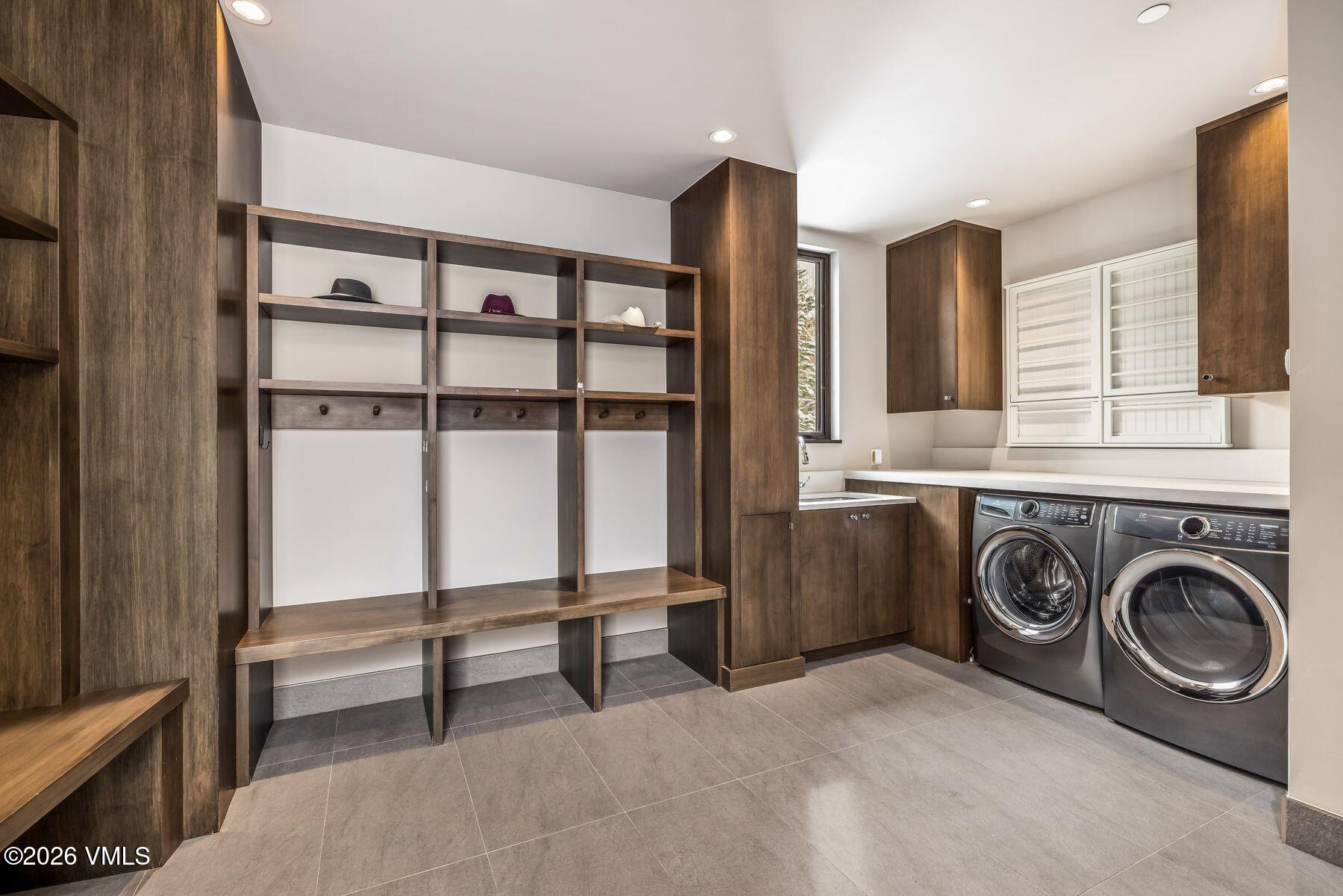 2440 Chamonix Lane Vail, CO 81657 - Photo 27 of 36 a utility room with dryer and washer