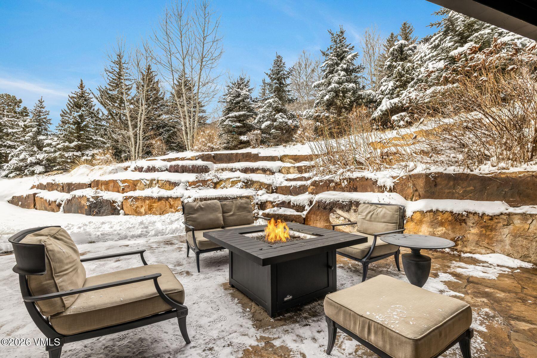 2440 Chamonix Lane Vail, CO 81657 - Photo 30 of 36 a terrace of a house with outdoor seating