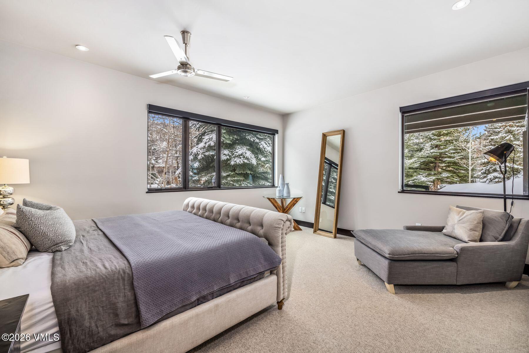 2440 Chamonix Lane Vail, CO 81657 - Photo 31 of 36 a bedroom with a bed and a large window