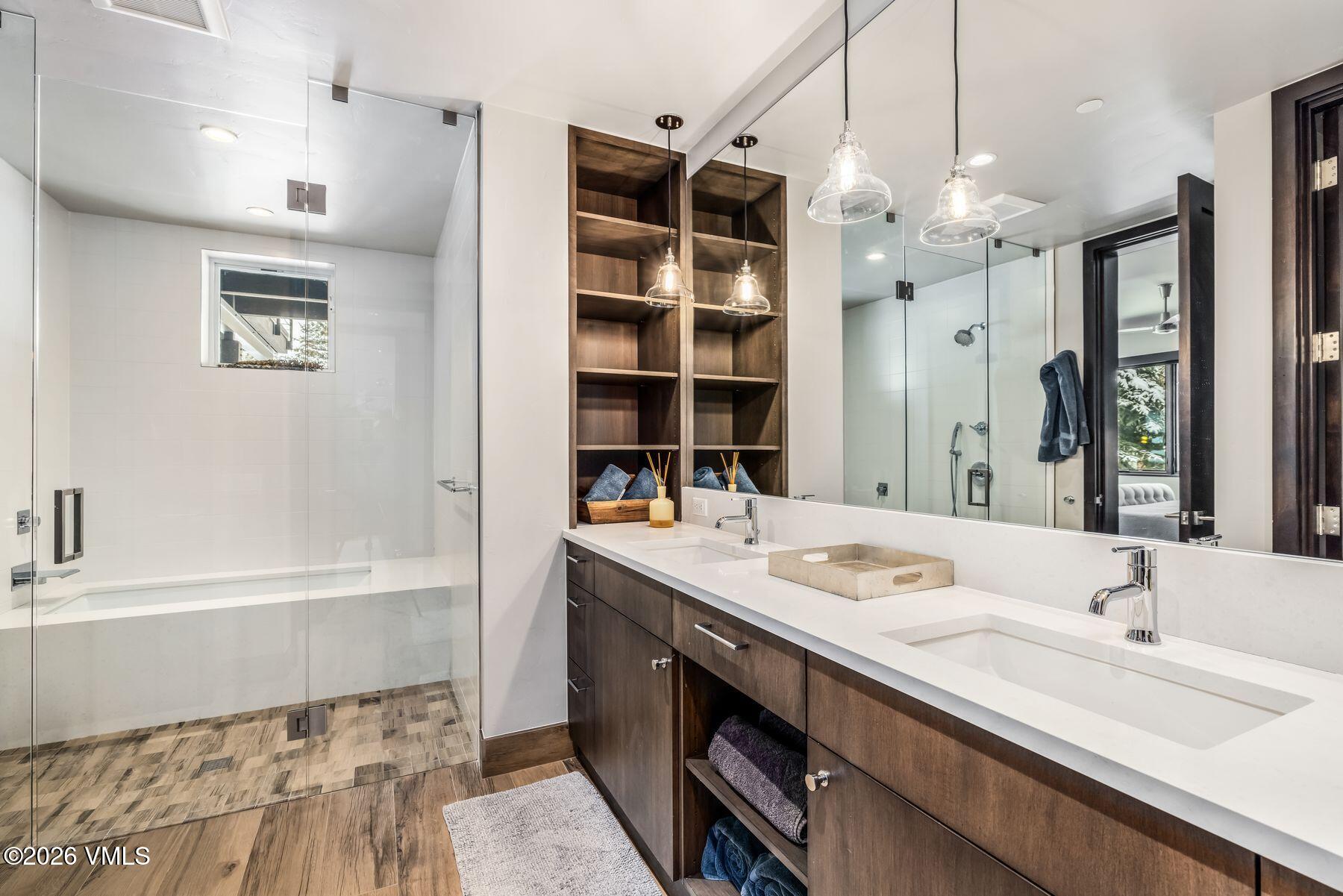 2440 Chamonix Lane Vail, CO 81657 - Photo 33 of 36 a bathroom with a double vanity sink mirror and double
