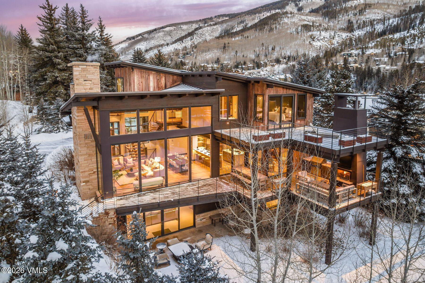 2440 Chamonix Lane Vail, CO 81657 - Photo 35 of 36 a front view of a house with balcony
