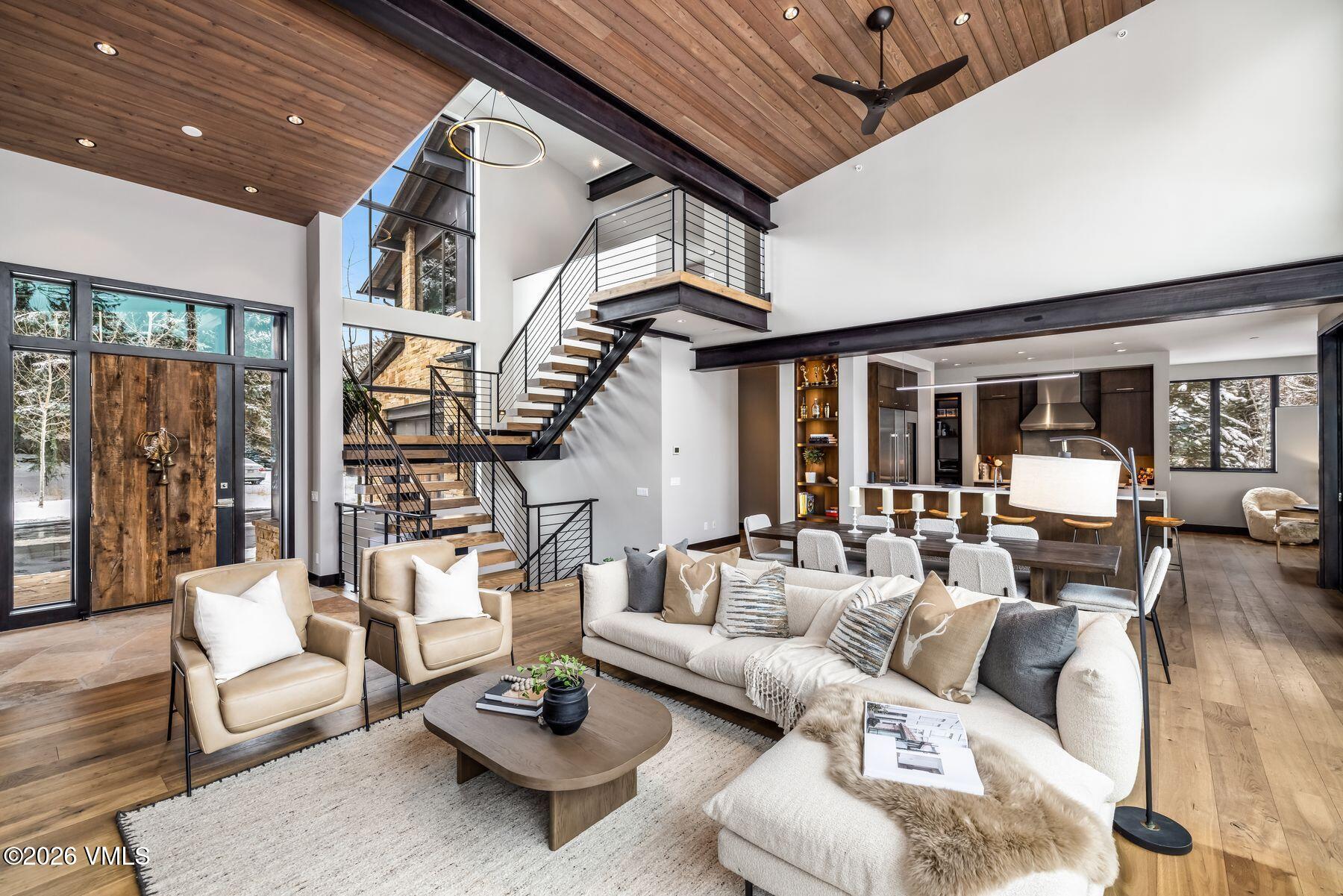 2440 Chamonix Lane Vail, CO 81657 - Photo 4 of 36 a living room with furniture and a large window