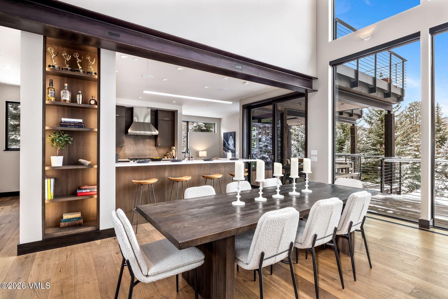 2440 Chamonix Lane Vail, CO 81657 - Photo 5 of 36 a dining room with furniture and wooden floor