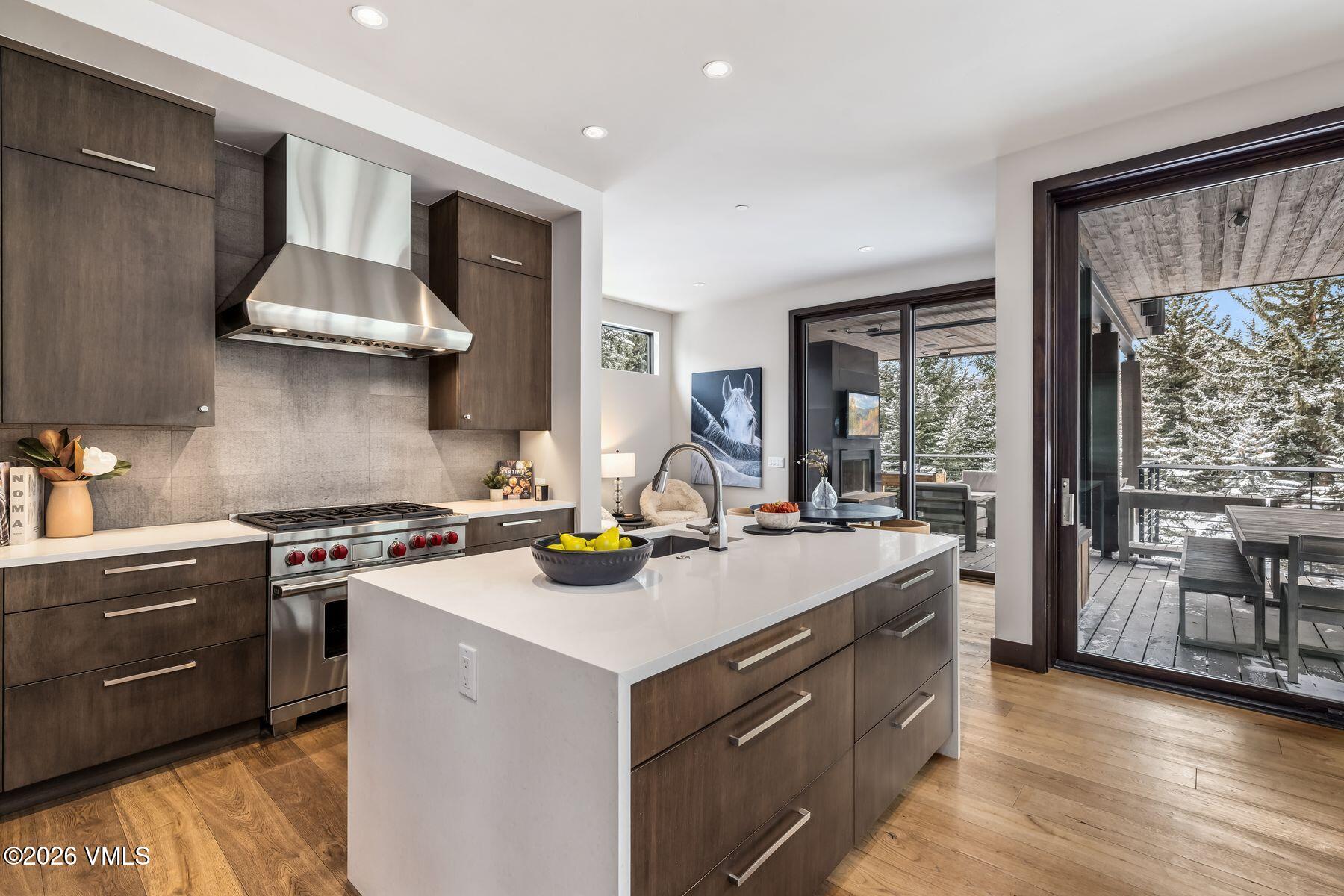 2440 Chamonix Lane Vail, CO 81657 - Photo 10 of 36 a kitchen that has a stove and a sink