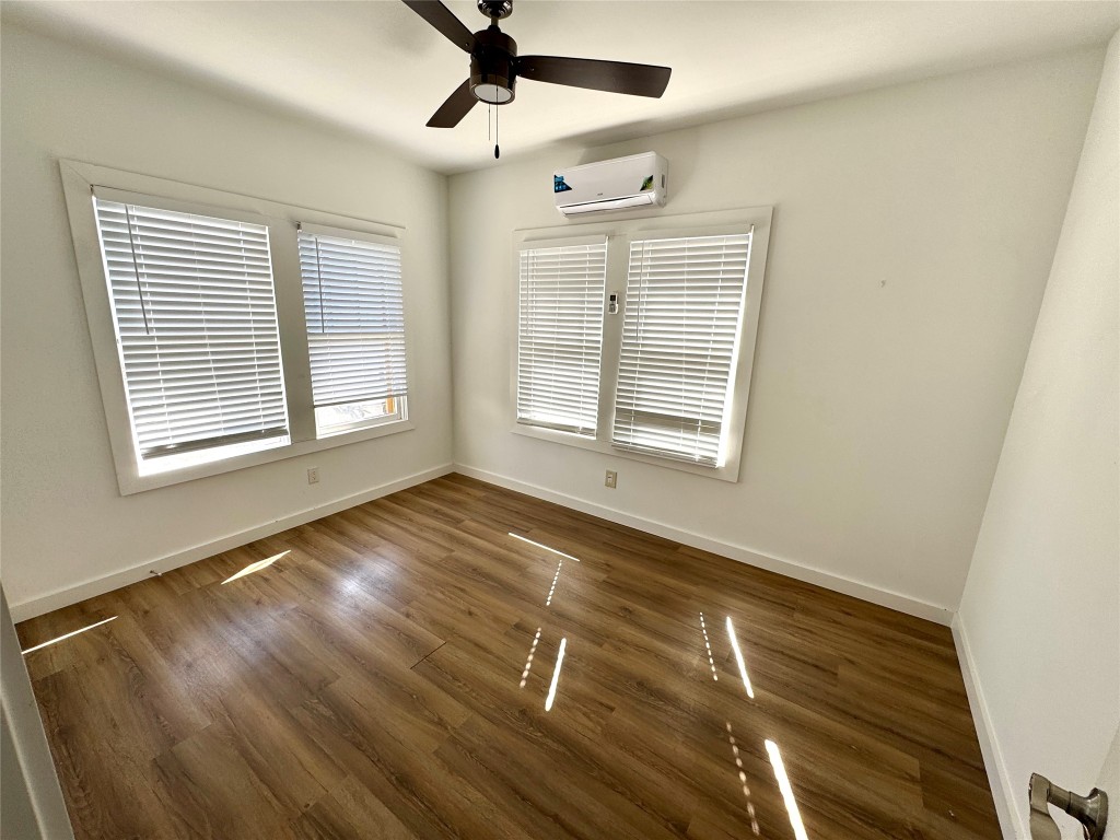7 Hunt Street Houston, TX 77003 - Photo 17 of 23 a view of empty room with wooden floor and fan