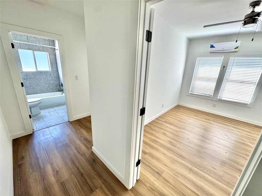7 Hunt Street Houston, TX 77003 - Photo 19 of 23 a view of a room with wooden floor and a bathroom