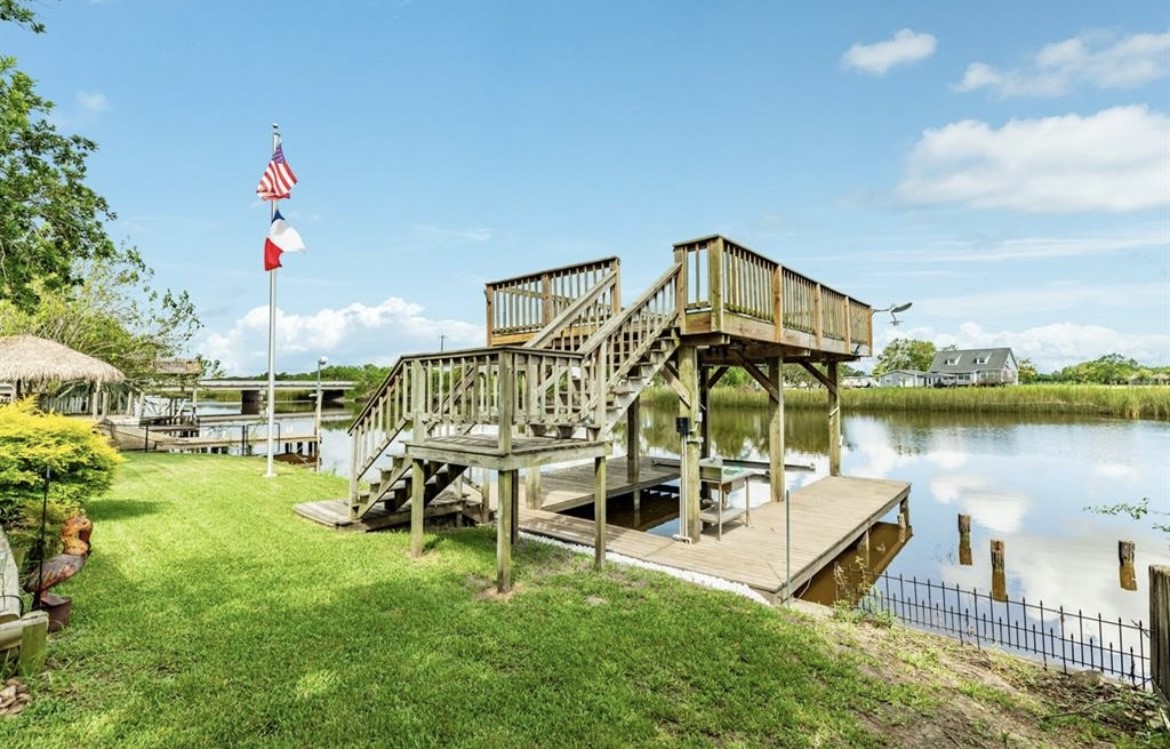 131 Bastrop Bayou Drive Angleton, TX 77515 - Photo 25 of 36 a view of a house with a yard and sitting area