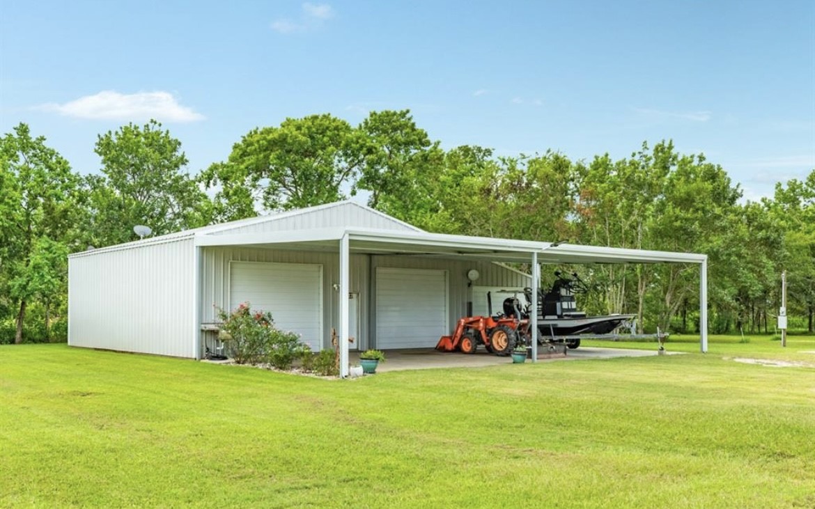 131 Bastrop Bayou Drive Angleton, TX 77515 - Photo 29 of 36 a view of a porch with furniture and garden