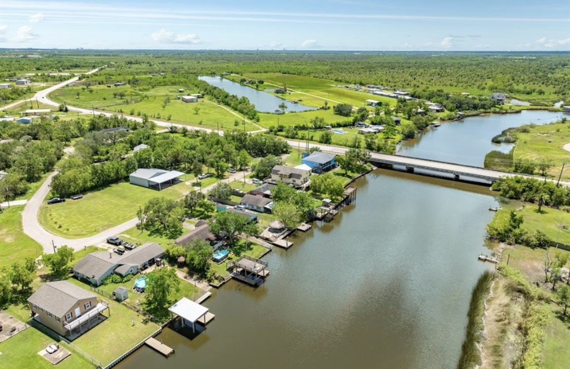 131 Bastrop Bayou Drive Angleton, TX 77515 - Photo 34 of 36 an aerial view of residential houses with outdoor space