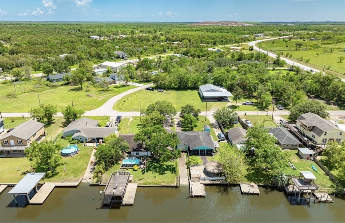 131 Bastrop Bayou Drive Angleton, TX 77515 - Photo 36 of 36 an aerial view of residential houses with outdoor space and swimming pool